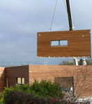 Pose d'un mur en bois pré-fabriqué