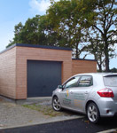 Vue du garage d'une maison bois ECOP Habitat