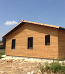 Vue extérieure d'une maison écologique en bois ECOP Habitat