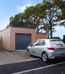 Vue du garage d'une maison en bois ECOP Habitat